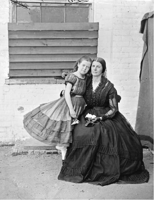 The photograph shows Rose Greenhow with her arm around her daughter.